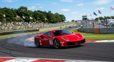 Red supercar speeding on a race track
