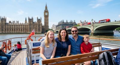 A family enjoying a sightseeing river cruise in London