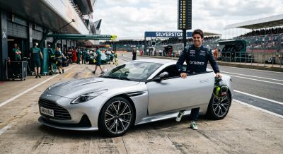 Silver Aston Martin in the pit lane