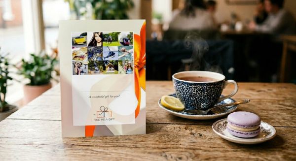 Gift voucher next to a cup of tea