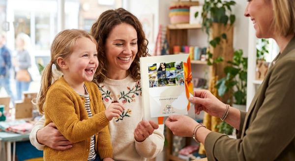 A family receiving a gift experience voucher
