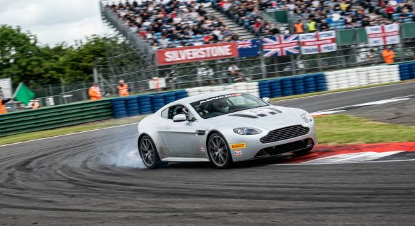 Aston Martin driving on a race track