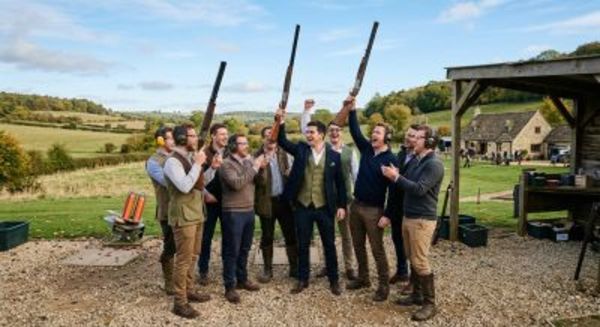 Groomsmen enjoying a clay pigeon shooting experience in the countryside