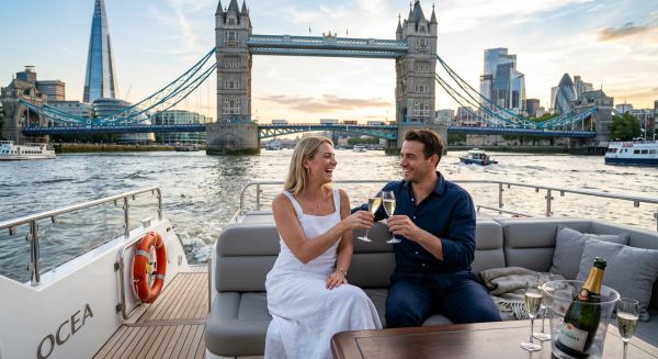 Couple enjoying a champagne cruise on the River Thames