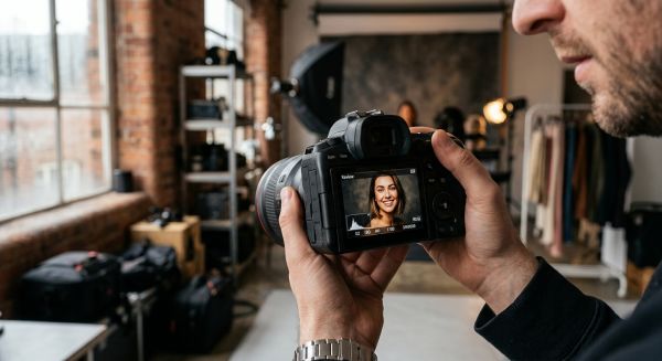 Reviewing images on a camera screen during a photoshoot