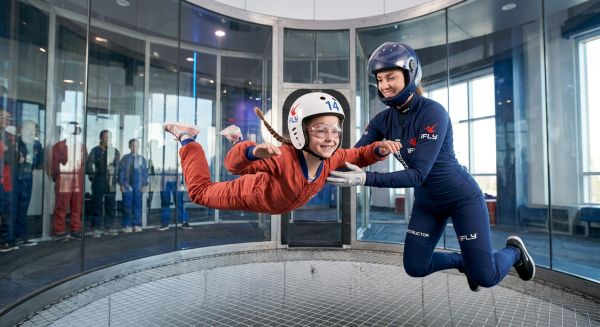 Child enjoying an indoor skydiving flight