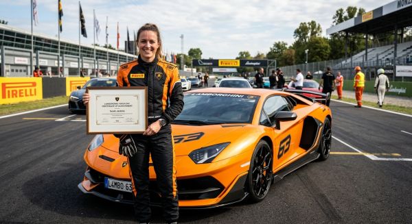 Driver holding a track day completion certificate