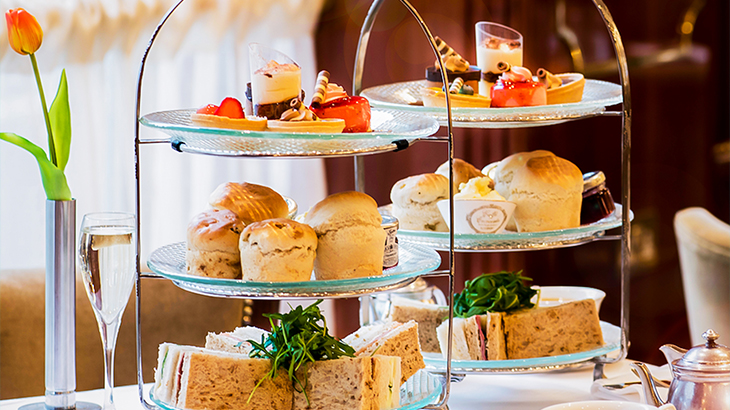 Luxury afternoon tea experience with sandwiches, scones, and desserts – elegant wedding gift idea for couples who love gourmet indulgence