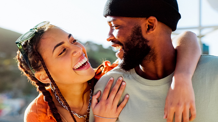 Happy couple laughing together while enjoying a fun gift experience, perfect idea for romantic and unique couple gifts