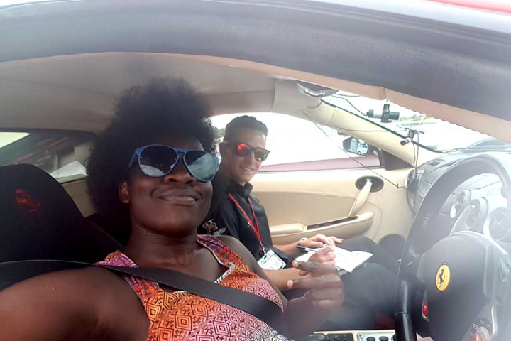 Anne and her instructor behind the wheel of a Ferrari